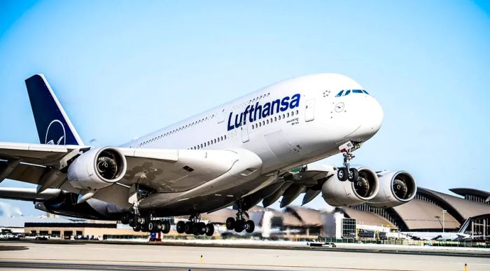 A Lufthansa A380 taking off into the sky