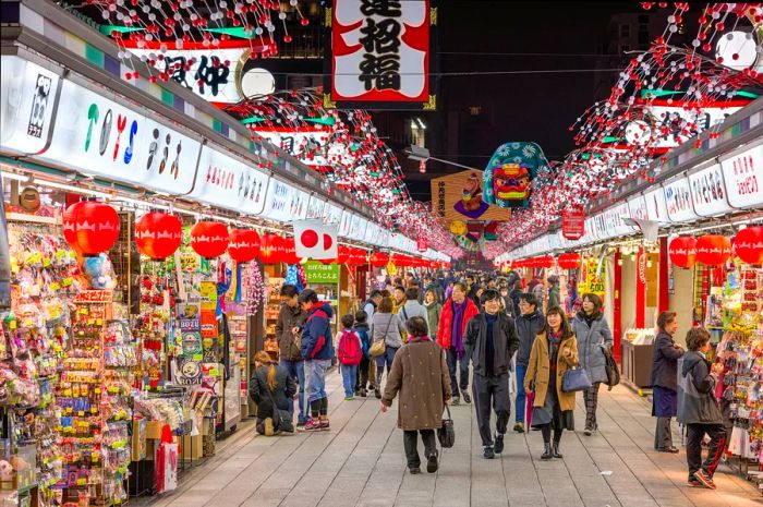 Visitors at Senosoji Temple stroll along Nakamise Shopping Street