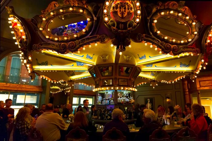 Guests enjoying the rotating bar at the Carousel Bar, Hotel Monteleone, French Quarter, New Orleans, Louisiana, USA