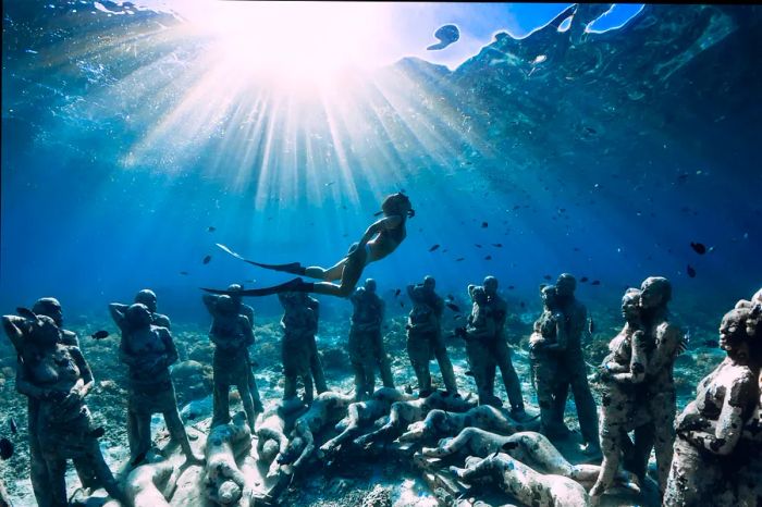 Woman scuba diving near Gili Meno, Indonesia