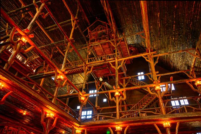 Wooden beams crafted from logs in the grand hall of Old Faithful Inn, Yellowstone National Park, Wyoming, USA