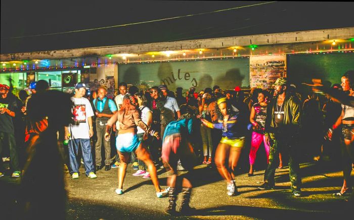 A vibrant gathering at a dancehall street party, filled with dancing and celebration