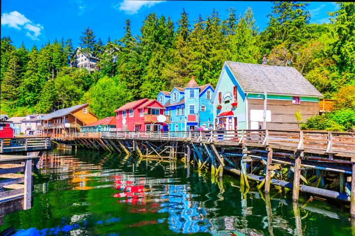 A vibrant array of shop fronts elevated on a pier overlooking a quaint dock