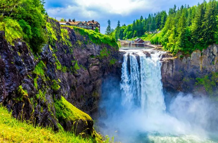 A powerful waterfall cascades into a canyon.