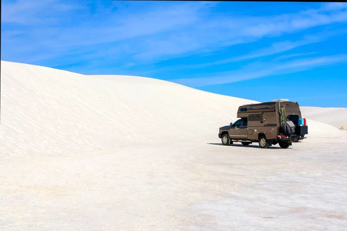 A camper enjoying the dunes at White Sands National Park, New Mexico, USA