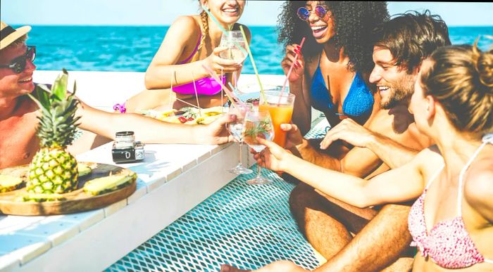 A group of friends enjoying cocktails on a catamaran in Croatia