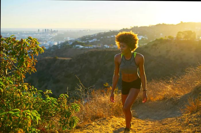 An athletic woman enjoys a walk in Runyon Canyon, Los Angeles, California, USA