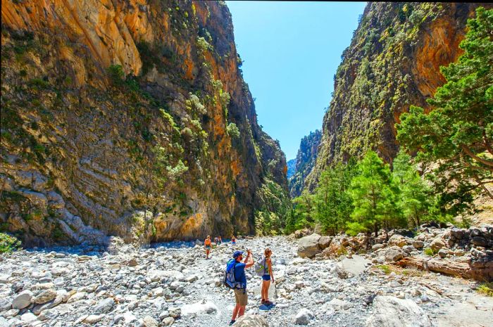 Tourists explore the Samaria Gorge in central Crete