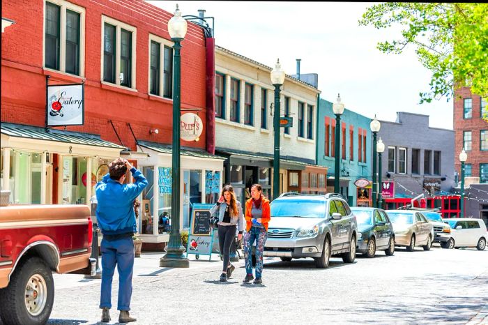 A group captures a moment on a charming street in downtown Asheville, North Carolina, USA