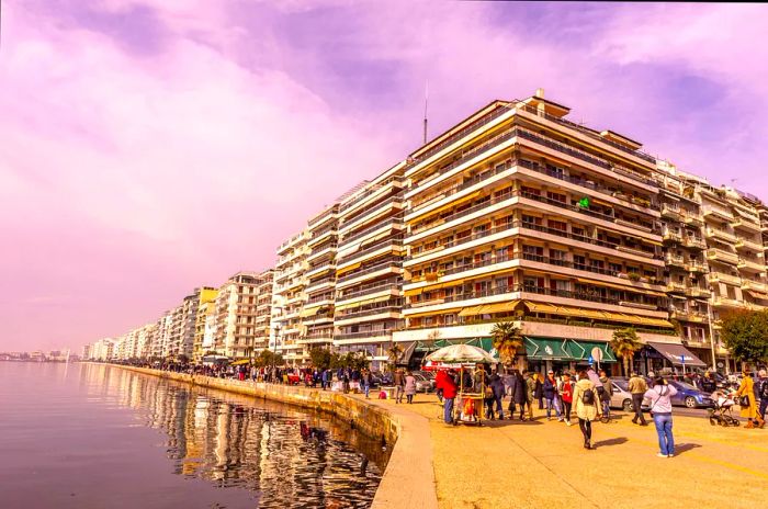 Strollers enjoy the views along the New Waterfront promenade, Thessaloniki, Macedonia, Greece