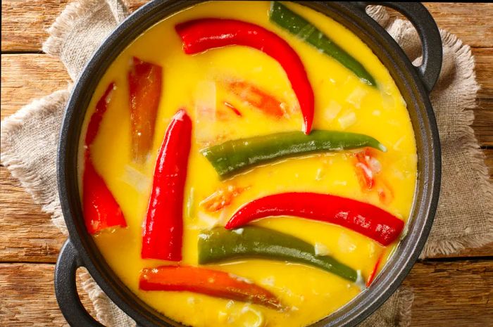 An aerial view of a pan filled with chilies and cheese, known as ema datse, the national dish of Bhutan.