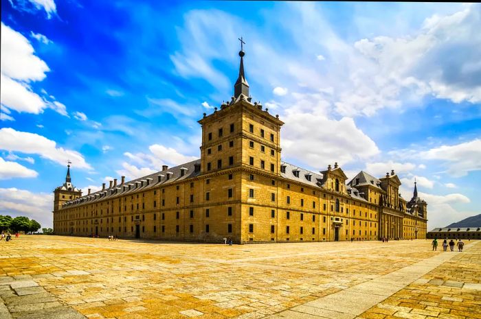 A grand monastery building set in an empty square