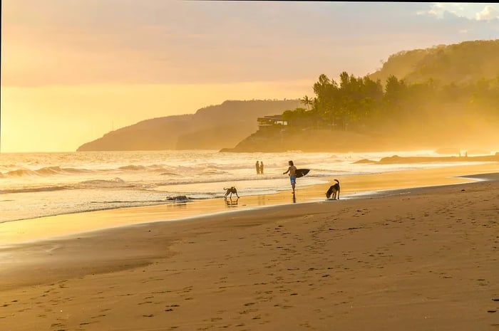 A surfer enjoying the waves at El Zonte beach in El Salvador