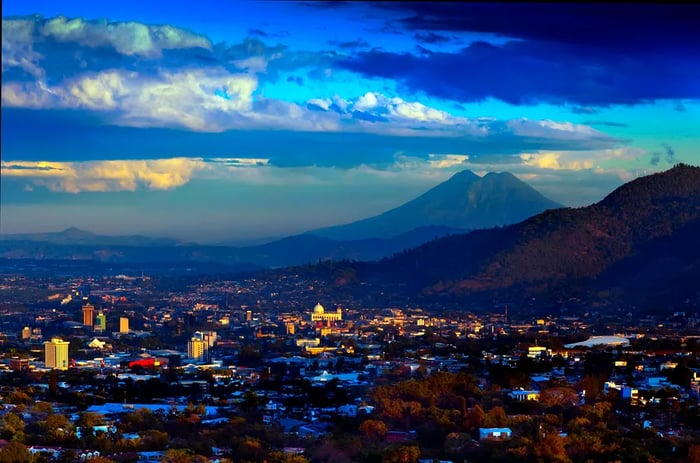 A sunset view of San Salvador alongside San Vicente Volcano, El Salvador