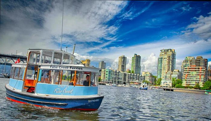 A miniferry glides through Vancouver's waterways on a sunny day