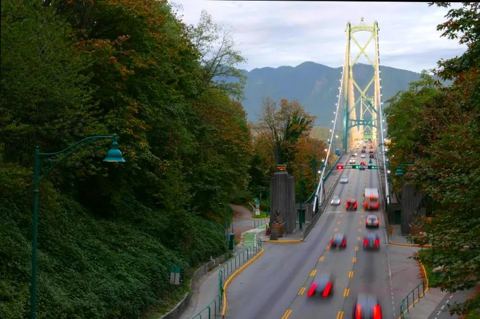 Blurred motion of a car navigating Lions Gate Bridge in Stanley Park, Vancouver, BC, Canada