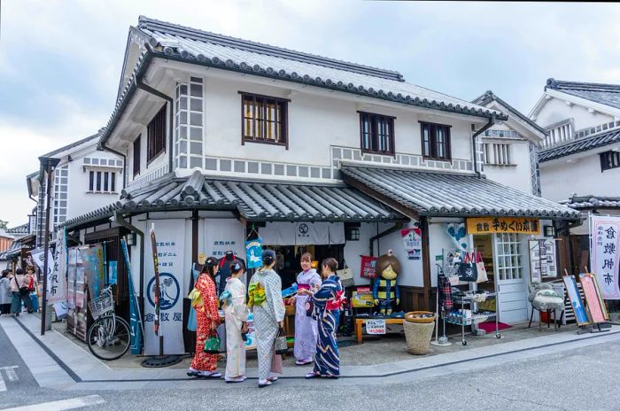 Women dressed in kimonos in the Kurashiki Bikan Historical Quarter, Kurashiki, Japan