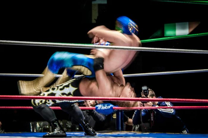 Two lucha libre wrestlers engage in a match in Mexico