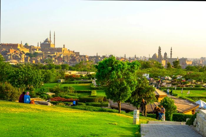 A view of the Al-Azhar Park gardens, with the Great Mosque of Muhammad Ali Pasha situated in the background within the Citadel of Cairo.