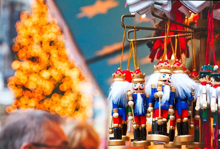 Decorative toy souvenirs featuring a white-haired nutcracker holding a baton on display.