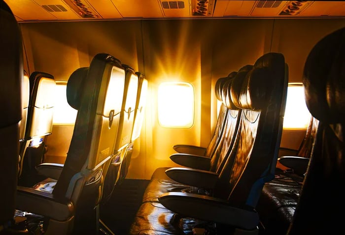 The bright sunlight streaming through the airplane window.