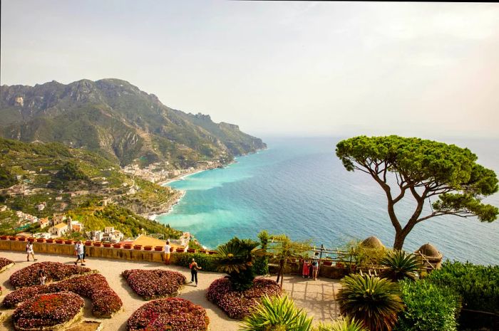 The garden of Villa Rufolo in Ravello, framed by the Mediterranean Sea in the background.