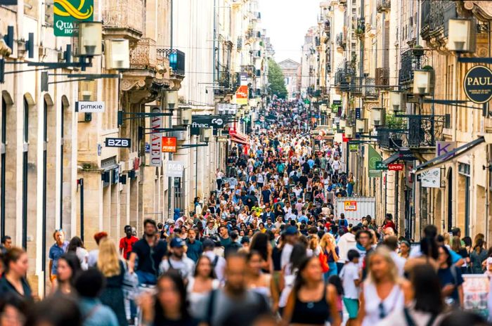 Throngs of shoppers fill rue Sainte-Catherine, the bustling shopping street in Bordeaux, France