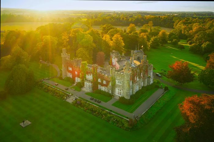 Aerial view of the 15th-century Luttrellstown Castle, Ireland, basking in the morning sun in Dublin