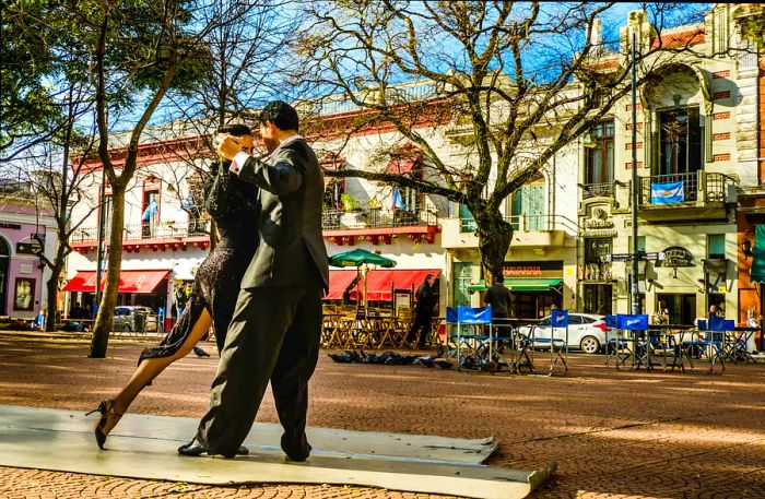 Two tango dancers showcase their artistry at Plaza Serrano in the San Telmo neighborhood of Buenos Aires.