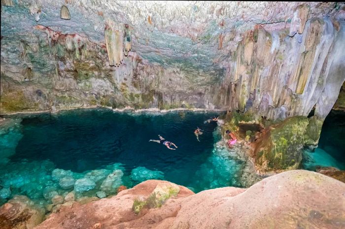 Swimmers enjoy the underground Cueva de Saturno near Varadero, Cuba