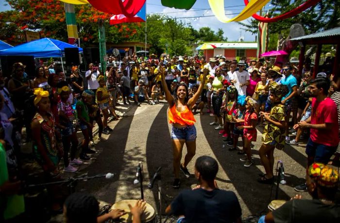 A participant dances during the celebrations of the Saint James the Apostle festival in Loíza, Puerto Rico.