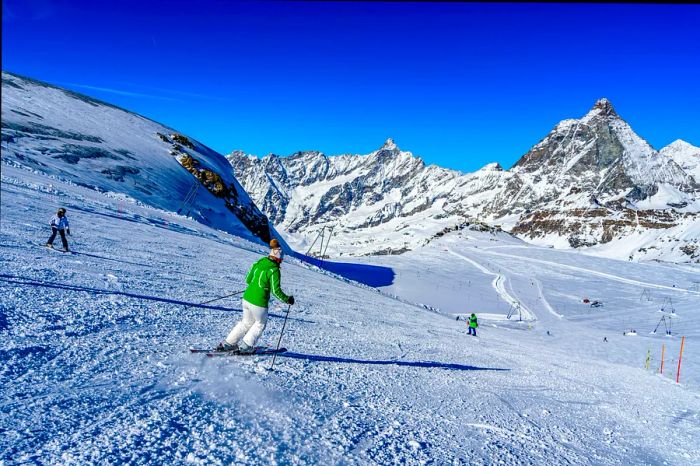 A skier navigates a trail at a resort in Breuil-Cervinia, Italy, Alps