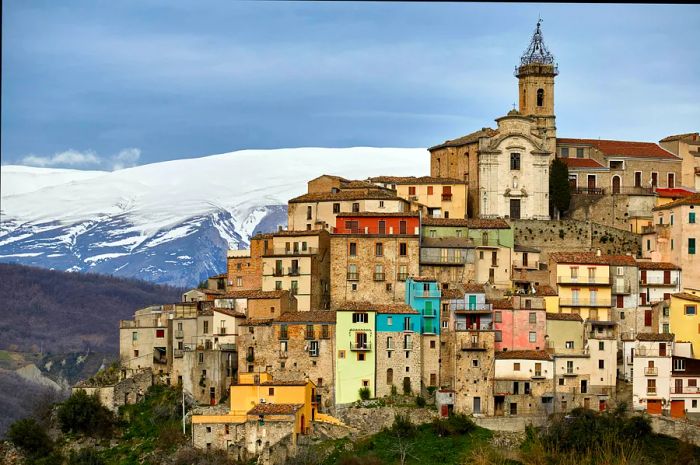 The picturesque village of Colledimezzo set against a mountain backdrop, Abruzzo, Italy