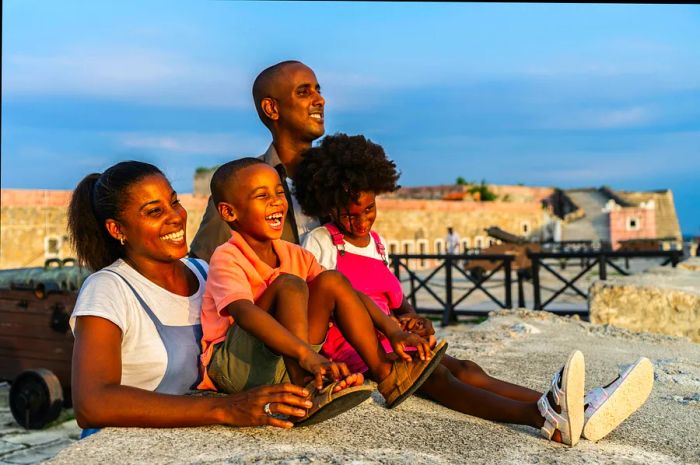 Family admiring the view from a hilltop castle in Cuba