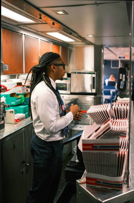 An attendant serves in the dining car of the Silver Meteor.