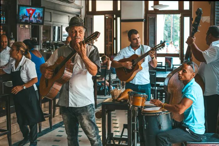 Cuban band performing live music at Dos Hermanos bar in Havana, Cuba.