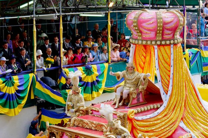 Mardi Gras parade float featuring Rex, King of Carnival, greeting the crowd in New Orleans, USA