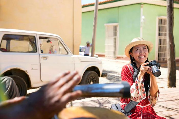 A woman captures candid moments in Trinidad, Cuba