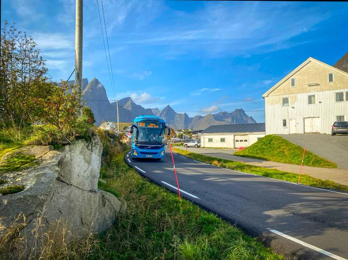 A bus travels through a vibrant village in Norway