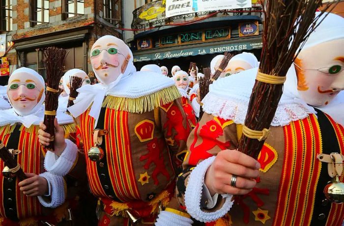 Les Gilles de Binche celebrate Mardi Gras in Binche, a Carnival recognized as a UNESCO World Heritage site.