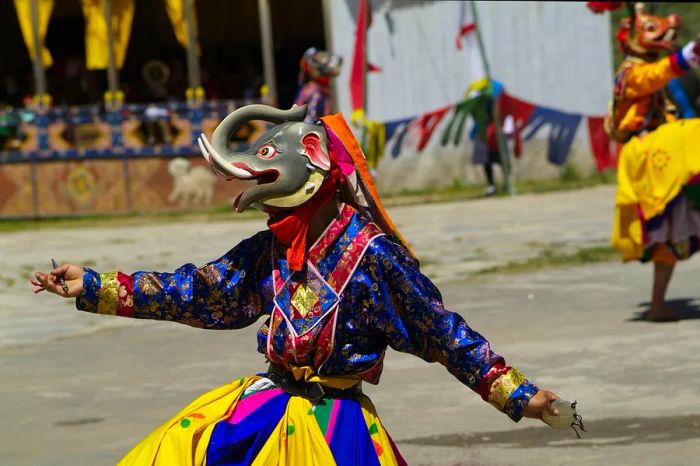 Dancers and onlookers at the Tshechu festival at the White Temple (Karpho Lhakhang), Haa, Bhutan.