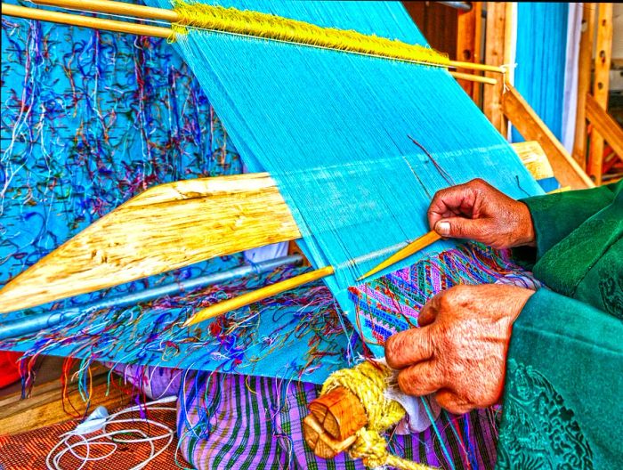 A woman’s hands expertly weaving in Bhutan