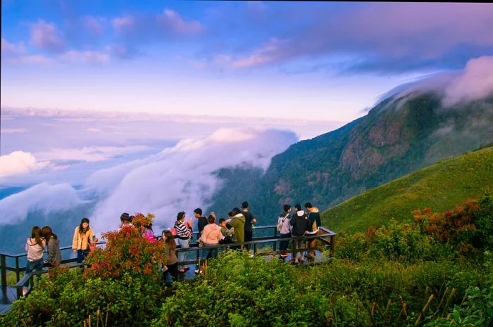 Tourists gather at a viewpoint along the Kew Mae Pan Nature Trail in the Chom Thong District, Chiang Mai, Thailand