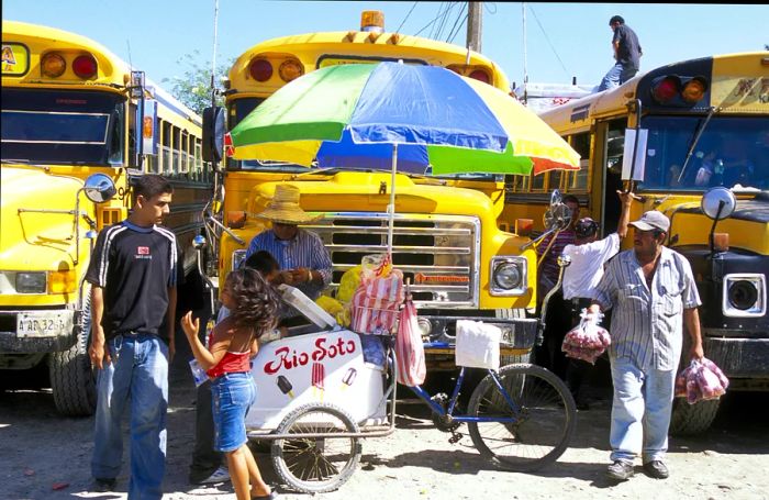 Local buses at the terminal in Tela, near San Pedro Sula, Honduras