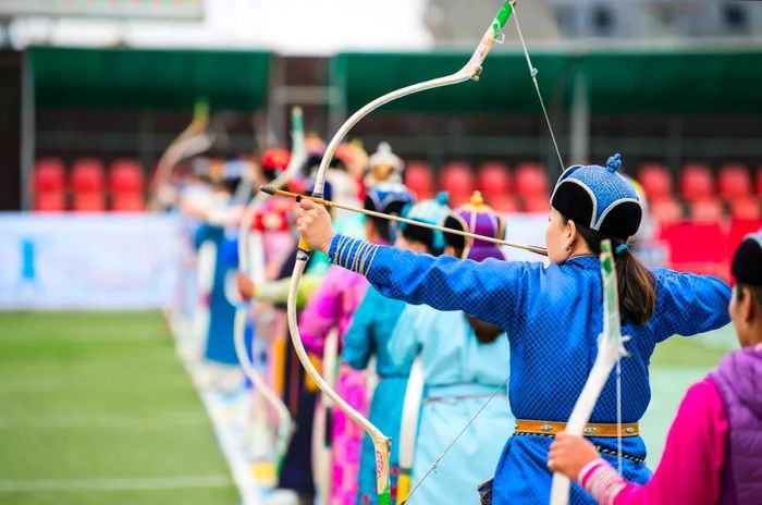 Women participate in an archery contest in Mongolia.