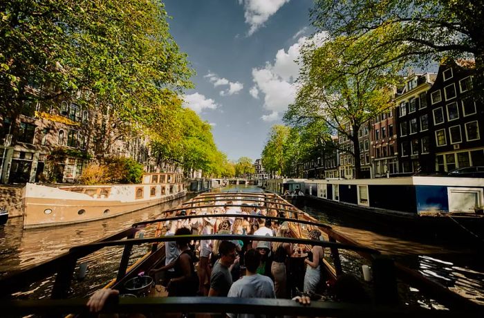 An interior view of the brunch boat navigating one of Amsterdam's picturesque canals.