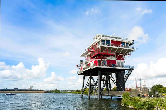 A view of the REM Eiland restaurant in Amsterdam, rising majestically above the water