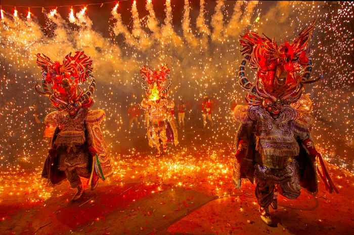 Participants in vibrant costumes at the colorful Carnival de Oruro