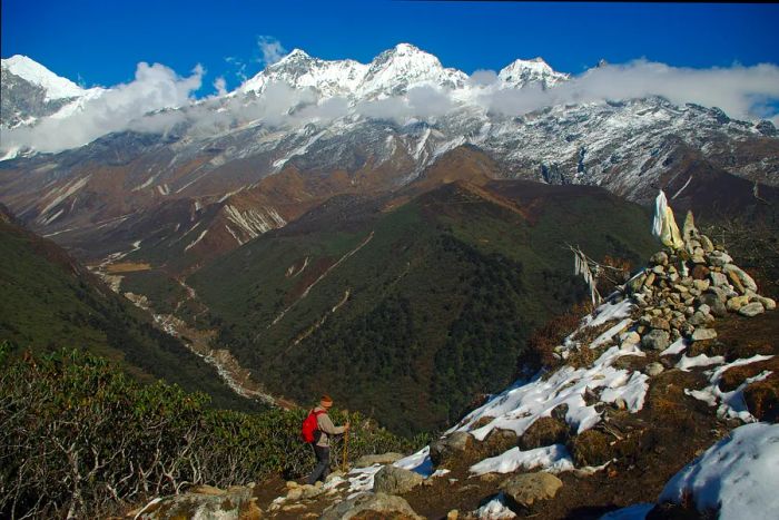 A trekker walks in front of Khangchendzonga in Sikkim