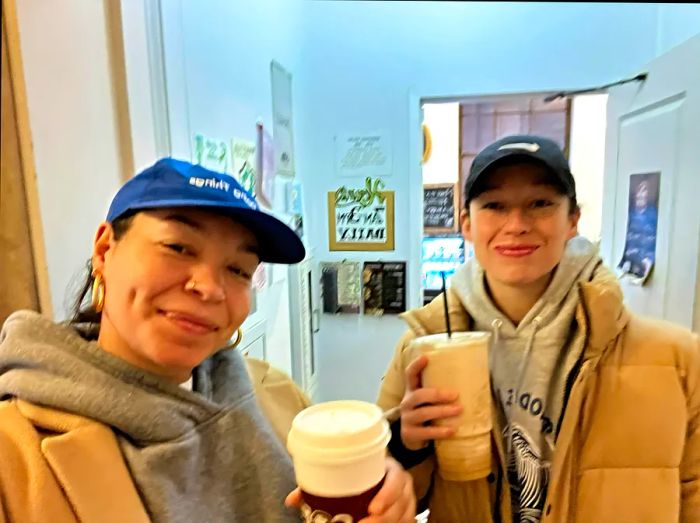 Rachel, the article's author, and her wife enjoy coffees together at a café in Providence.